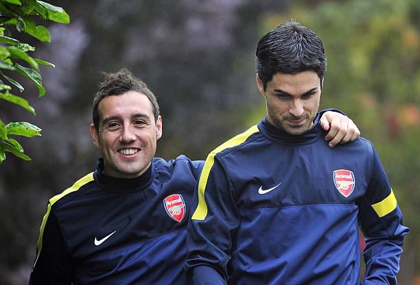 Arsenal's Spanish midfielder Santi Cazorla (L) and Spanish midfielder Mikel Arteta (R) attend training for the forthcoming UEFA Champions League group B football match against FC Schalke 04 at Arsenal's training ground, London Colney, North London, England on October 23, 2012. AFP PHOTO/GLYN KIRK