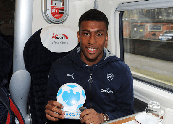 Arsenal's Alex Iwobi with his Man Of The Match award on the train back to London after the Barclays Premier League match between Everton and Arsenal at Goodison Park on March 19, 2016 in Liverpool, England.| Credit: Stuart MacFarlane