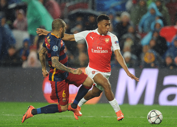 Alex Iwobi of Arsenal takes on Dani Alves of Barcelona during the match between FC Barcelona and Arsenal at Camp Nou on March 16, 2016 in Barcelona, Spain. | Credit: David Price