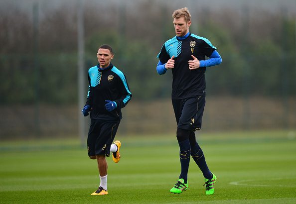ST ALBANS, ENGLAND - MARCH 15: Per Mertesacker and Kieran Gibbs of Arsenal run during a training session ahead of the UEFA Champions League round of 16 second leg match between Barcelona and Arsenal at London Colney on March 15, 2016 in St Albans, England. (Photo by Dan Mullan/Getty Images)