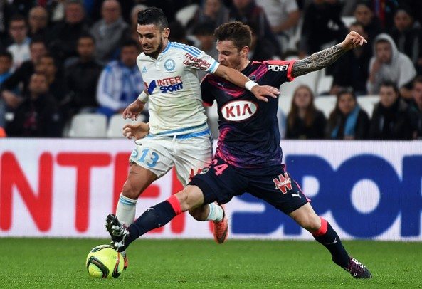 Marseille's French midfielder Remy Cabella (L) vies with Bordeaux's French defender Mathieu Debuchy during the French L1 football match Marseille vs Bordeaux on April 10, 2016 at the Velodrome stadium in Marseille, southern France. AFP PHOTO / ANNE-CHRISTINE POUJOULAT / AFP / ANNE-CHRISTINE POUJOULAT (Photo credit should read ANNE-CHRISTINE POUJOULAT/AFP/Getty Images)