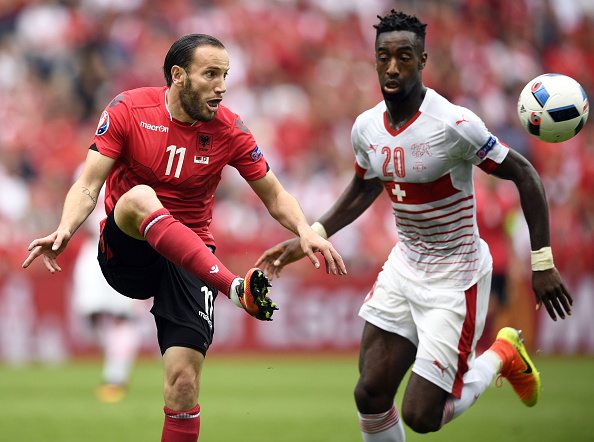 (LtoR)Albania's midfielder Shkelzen Gashi vies for the ball with Switzerland's defender Johan Djourou during the Euro 2016 group A football match between Albania and Switzerland at the Bollaert-Delelis Stadium in Lens on June 11, 2016. / AFP / MARTIN BUREAU        (Photo credit should read MARTIN BUREAU/AFP/Getty Images)
