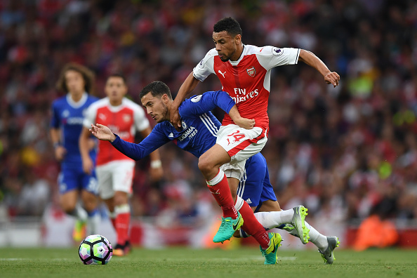 Coquelin (right) in action against Chelsea, before sustaining his knee injury. | Photo: Shaun Botterill / Getty Images