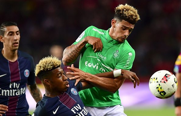 Paris Saint-Germain's French defender Presnel Kimpembe (L) vies with Saint-Etienne's French defender Kevin Malcuit during the French L1 football match between Paris Saint-Germain and Saint-Etienne at the Parc des Princes stadium in Paris on September 9, 2016. / AFP / FRANCK FIFE