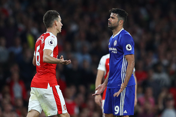 Diego Costa (right) was far from a happy man on Saturday, as he was reduced to half-chances and effectively shut out by the centre-back pairing of Mustafi and Laurent Koscielny (pictured). | Photo: Paul Gilham / Getty Images