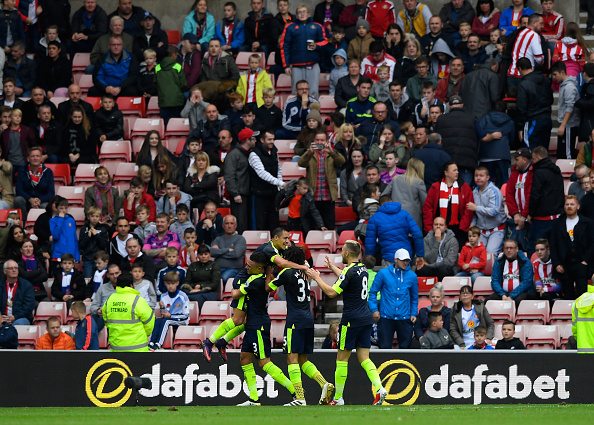 SUNDERLAND, ENGLAND - OCTOBER 29: Alexis Sanchez (1st L) of Arsenal celebrates scoring his team's fourth goal with his team-mates during the Premier League match between Sunderland and Arsenal at the Stadium of Light on October 29, 2016 in Sunderland, England.