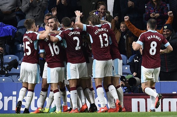 Burnley players celebrates their second goal scored by Burnley's English defender Michael Keane during the English Premier League football match between Burnley and Watford at Turf Moor in Burnley, north west England on September 26, 2016. / AFP / OLI SCARFF / RESTRICTED TO EDITORIAL USE. No use with unauthorized audio, video, data, fixture lists, club/league logos or 'live' services. Online in-match use limited to 75 images, no video emulation. No use in betting, games or single club/league/player publications. / (Photo credit should read OLI SCARFF/AFP/Getty Images)