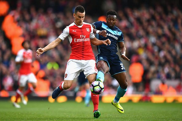 LONDON, ENGLAND - OCTOBER 22: Laurent Koscielny of Arsenal and Adam Forshaw of Middlesbrough compete for the ball during the Premier League match between Arsenal and Middlesbrough at Emirates Stadium on October 22, 2016 in London, England. (Photo by Dan Mullan/Getty Images)