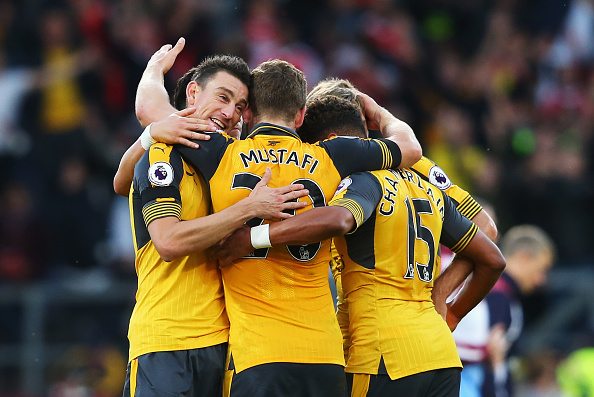 BURNLEY, ENGLAND - OCTOBER 02: Laurent Koscielny of Arsenal (L) celebrates scoring his sides first goal with his team mates during the Premier League match between Burnley and Arsenal at Turf Moor on October 2, 2016 in Burnley, England. (Photo by Alex Livesey/Getty Images)