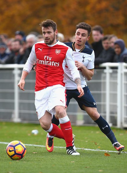 ENFIELD, ENGLAND - NOVEMBER 18: Anthony Georgiou of Tottenham Hotspur closes down Mathieu Debuchy of Arsenal during the Premier League 2 match between Tottenham Hotspur and Arsenal at at Tottenham Hotspur Training Centre on November 18, 2016 in Enfield, England.