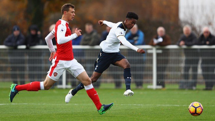 Shayon Harrison (right) strikes towards goal, but is thwarted by a sharp stop from Matt Macey. (Photo: Tottenham's official website)