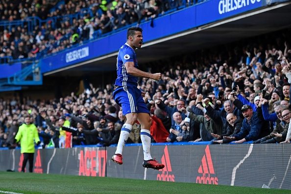 Chelsea's Brazilian-born Spanish striker Diego Costa celebrates after scoring the opening goal of the English Premier League football match between Chelsea and West Bromwich Albion at Stamford Bridge in London on December 11, 2016. / AFP / Justin TALLIS / RESTRICTED TO EDITORIAL USE. No use with unauthorized audio, video, data, fixture lists, club/league logos or 'live' services. Online in-match use limited to 75 images, no video emulation. No use in betting, games or single club/league/player publications. / (Photo credit should read JUSTIN TALLIS/AFP/Getty Images)