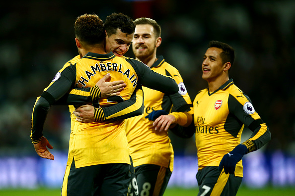 LONDON, ENGLAND - DECEMBER 03: Alex Oxlade-Chamberlain of Arsenal celebrates with team mates after scoring his team's fourth goal during the Premier League match between West Ham United and Arsenal at London Stadium on December 3, 2016 in London, England. (Photo by Jordan Mansfield/Getty Images)