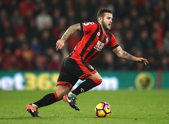 Jack Wilshere dribbles with the ball at his feet during the Premier League match between AFC Bournemouth and Leicester City at the Vitality Stadium on December 13, 2016 in Bournemouth, England.