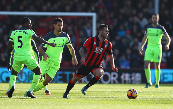 BOURNEMOUTH, ENGLAND - DECEMBER 04: Jack Wilshere of AFC Bournemouth evades Georginio Wijnaldum and Dejan Lovren of Liverpool during the Premier League match between AFC Bournemouth and Liverpool at Vitality Stadium on December 4, 2016 in Bournemouth, England. (Photo by Michael Steele/Getty Images)