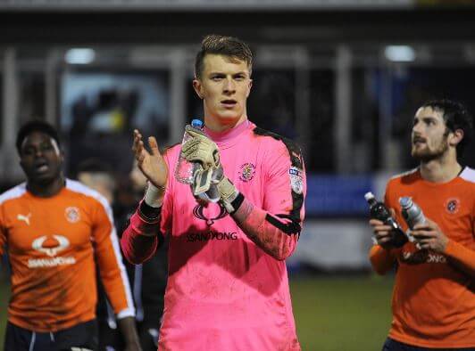 Macey applauds the home supporters after Luton's 2-1 win