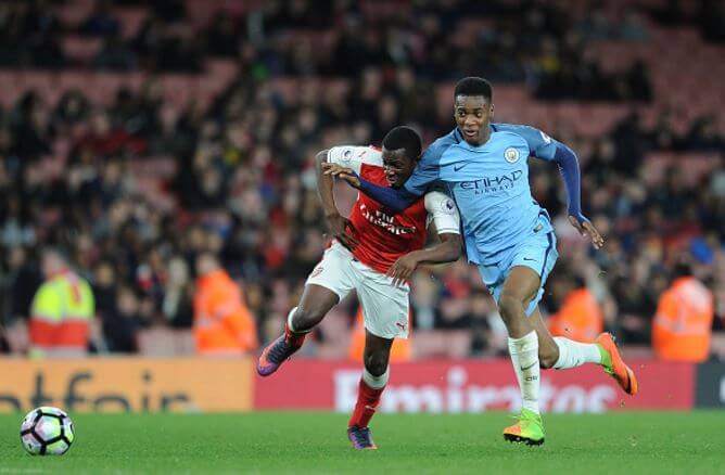 Nketiah (L) and Adarabioyo in pursuit of possession late on during the fierce encounter