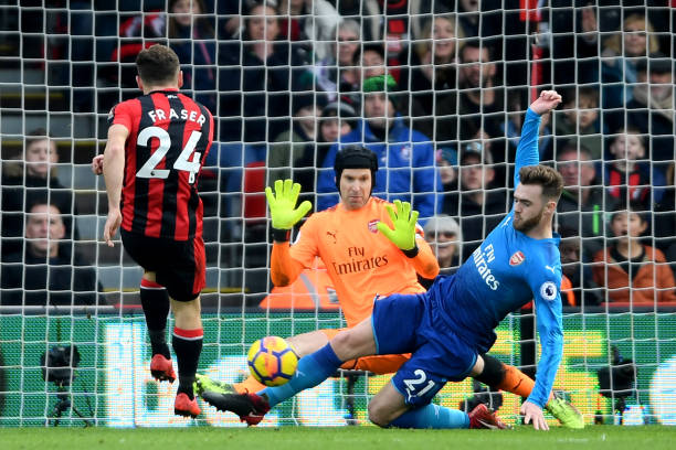 BOURNEMOUTH, ENGLAND - JANUARY 14: Calum Chambers of Arsenal blocks a shot from Ryan Fraser of AFC Bournemouth during the Premier League match between AFC Bournemouth and Arsenal at Vitality Stadium on January 14, 2018 in Bournemouth, England. (Photo by Mike Hewitt/Getty Images)