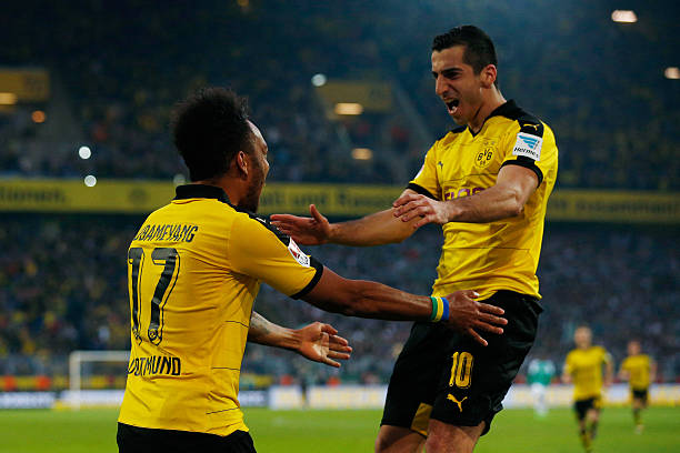 DORTMUND, GERMANY - APRIL 02: Pierre-Emerick Aubameyang (L) of Borussia Dortmund celebrates scoring his team's first goal with his team mate Henrikh Mkhitaryan (R) during the Bundesliga match between Borussia Dortmund and Werder Bremen at Signal Iduna Park on April 2, 2016 in Dortmund, Germany. (Photo by Dean Mouhtaropoulos/Bongarts/Getty Images)