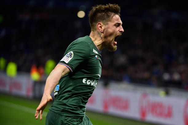Saint-Etienne's French defender Mathieu Debuchy celebrates after scoring a goal during the French L1 football match between Lyon (OL) and Saint-Etienne (ASSE) on February 25, 2018, at the Groupama stadium in Decines-Charpieu near Lyon, central-eastern France. / AFP PHOTO / ROMAIN LAFABREGUE