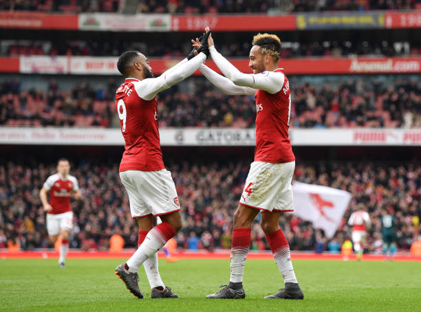 LONDON, ENGLAND - APRIL 01: Pierre-Emerick Aubameyang of Arsenal celebrates after scoring his sides second goal with Alexandre Lacazette of Arsenal during the Premier League match between Arsenal and Stoke City at Emirates Stadium on April 1, 2018 in London, England. (Photo by Shaun Botterill/Getty Images)
