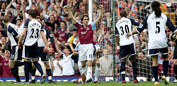 LONDON, UNITED KINGDOM: West Ham goal scorer Yossi Benayoun celebrates, surrounded by Tottenham players, during their Premiership football match against Tottenham, at home to West Ham, 07 May 2006. The match ended 2-1 to West Ham. AFP PHOTO/CARL DE SOUZA.