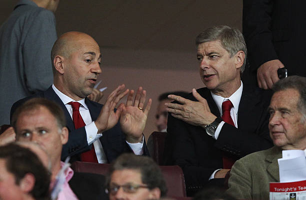 LONDON, ENGLAND - SEPTEMBER 28: Arsene Wenger manager of Arsenal (R) and Ivan Gazidis, CEO of Arsenal (L) in discussion as they sit in the stands prior to the UEFA Champions League Group F match between Arsenal and Olympiacos at the Emirates Stadium on September 28, 2011 in London, England. (Photo by Clive Rose/Getty Images)