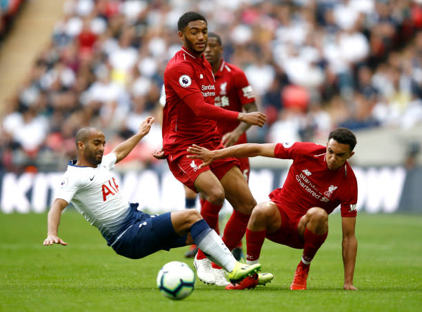 LONDON, ENGLAND - SEPTEMBER 15: Joe Gomez (C) and Trent Alexander-Arnold of Liverpool (R) battle for the ball with Lucas Moura of Tottenham Hotspur (L) during the Premier League match between Tottenham Hotspur and Liverpool FC at Wembley Stadium on September 15, 2018 in London, United Kingdom. (Photo by Julian Finney/Getty Images)