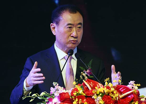 Wang Jianlin, chairman of Wanda Group, speaks at a ceremony in Beijing on February 10, 2015. China's Wanda Group has agreed to buy Infront -- the Swiss sports marketing group headed by Sepp Blatter's nephew and which holds some broadcasting rights to the World Cup -- for 1.05 billion euros (1.2 billion USD), the two firms said on February 10. AFP PHOTO / Greg BAKER (Photo credit should read GREG BAKER/AFP/Getty Images)