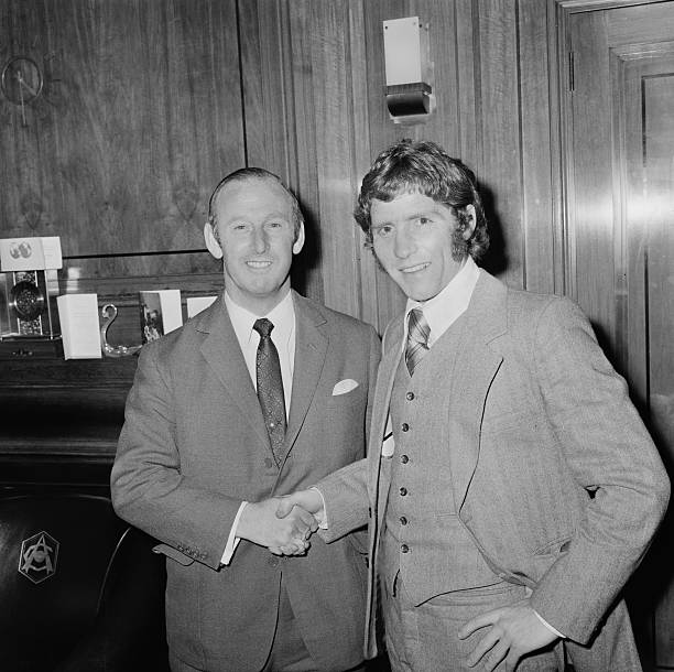 England footballer Alan Ball Jr. (1945 - 2007, right) with Arsenal manager Bertie Mee (1918 - 2001) after signing with Arsenal F.C. for a British cash record fee, UK, 22nd December 1971. (Photo by Les Lee/Daily Express/Getty Images)