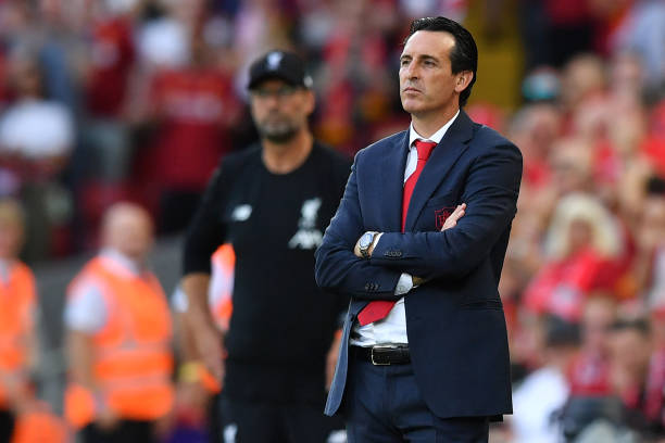 Arsenal's Spanish head coach Unai Emery (R) looks on during the English Premier League football match between Liverpool and Arsenal at Anfield in Liverpool, north west England on August 24, 2019. (Photo by Ben STANSALL / AFP)
