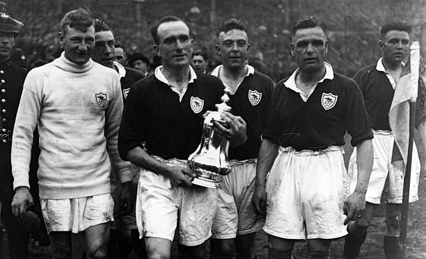 26th April 1930: Arsenal captain Tom Parker holding the FA Cup after beating Huddersfield 2-0 at Wembley. (Photo by Central Press/Getty Images)