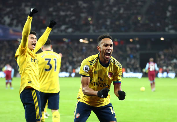 LONDON, ENGLAND - DECEMBER 09: Pierre-Emerick Aubameyang of Arsenal celebrates after scores his sides third goal during the Premier League match between West Ham United and Arsenal FC at London Stadium on December 09, 2019 in London, United Kingdom. (Photo by Julian Finney/Getty Images)