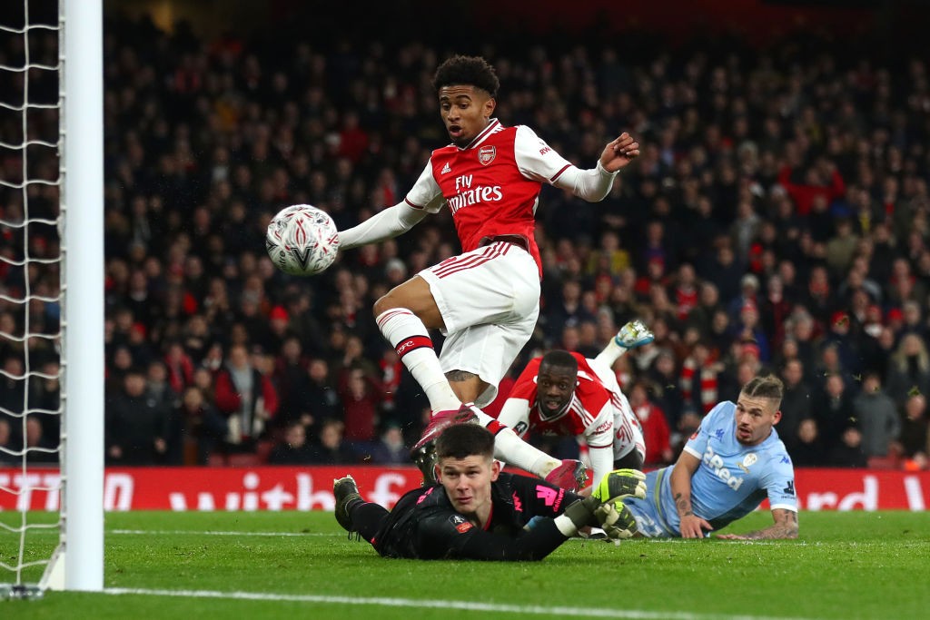 LONDON, ENGLAND - JANUARY 06: Reiss Nelson of Arsenal scores his side's first goal past Illan Meslier of Leeds United during the FA Cup Third Round match between Arsenal FC and Leeds United at the Emirates Stadium on January 06, 2020, in London, England. (Photo by Julian Finney/Getty Images)