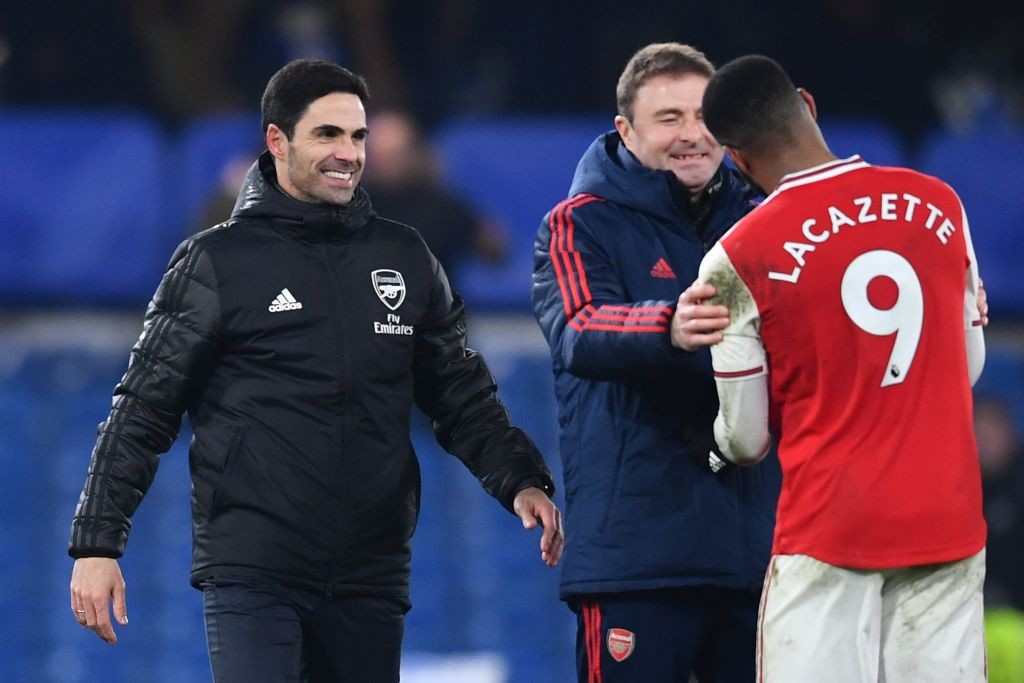 Arsenal's Spanish head coach Mikel Arteta (L) reacts with Arsenal's French striker Alexandre Lacazette after the English Premier League football match between Chelsea and Arsenal at Stamford Bridge in London on January 21, 2020. - The match ended in a draw at 2-2. (Photo by Ben STANSALL / AFP)