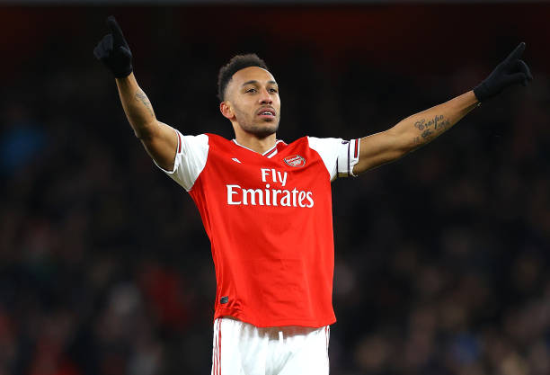 Pierre-Emerick Aubameyang of Arsenal celebrates after he scores his sides first goal during the Premier League match between Arsenal FC and Newcastle United at Emirates Stadium on February 16, 2020 in London, United Kingdom.
