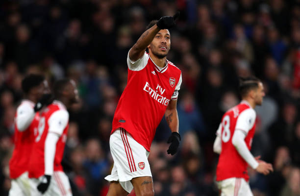 Pierre-Emerick Aubameyang of Arsenal celebrates after scoring his sides third goal during the Premier League match between Arsenal FC and Everton FC at Emirates Stadium on February 23, 2020 in London, United Kingdom.