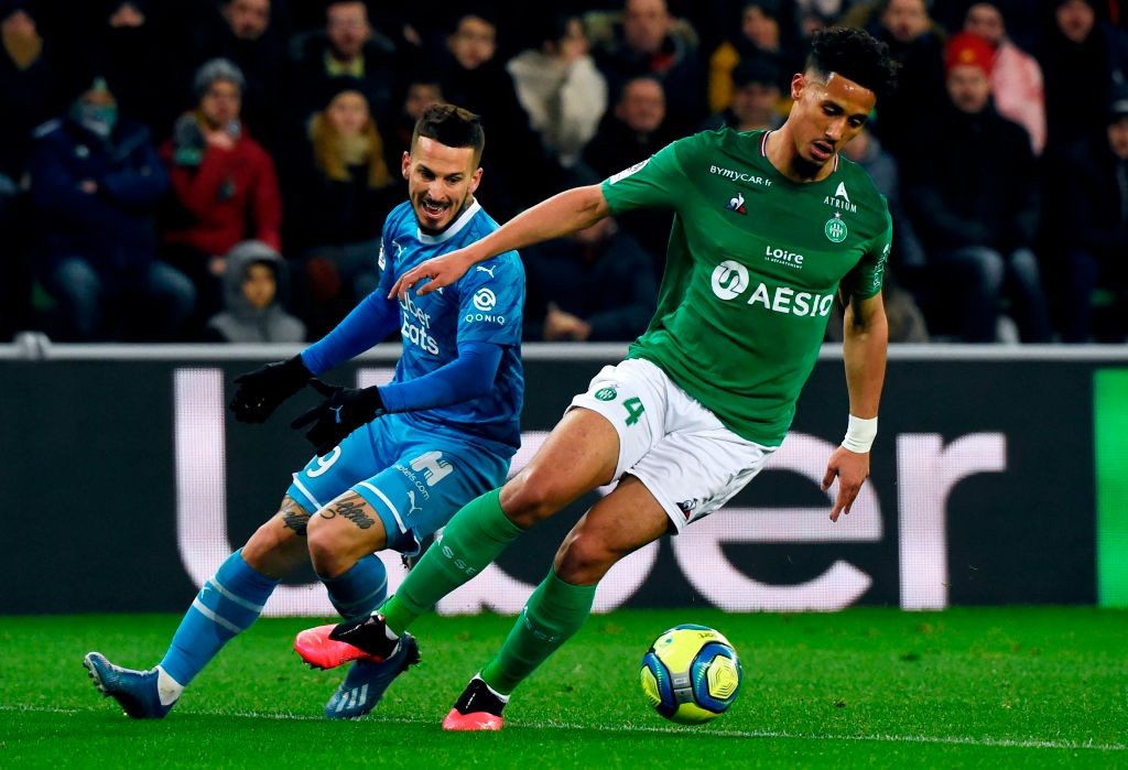 Marseille's Argentinian forward Dario Benedetto (L) vies for the ball with Saint-Etienne's French defender William Saliba (R) during the French L1 football match between Saint-Etienne (ASSE) and Marseille (OM) on February 5, 2020, at the Geoffroy Guichard Stadium in Saint-Etienne, central France. (Photo by JEAN-PHILIPPE KSIAZEK / AFP)