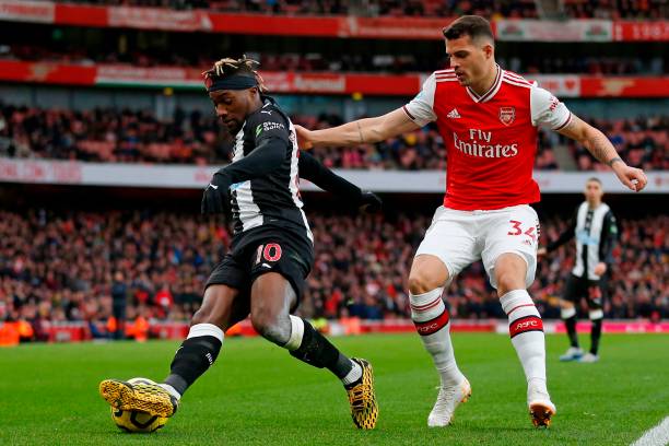 Newcastle United's French midfielder Allan Saint-Maximin (L) vies with Arsenal's Swiss midfielder Granit Xhaka (R) during the English Premier League football match between Arsenal and Newcastle United at the Emirates Stadium in London on February 16, 2020.