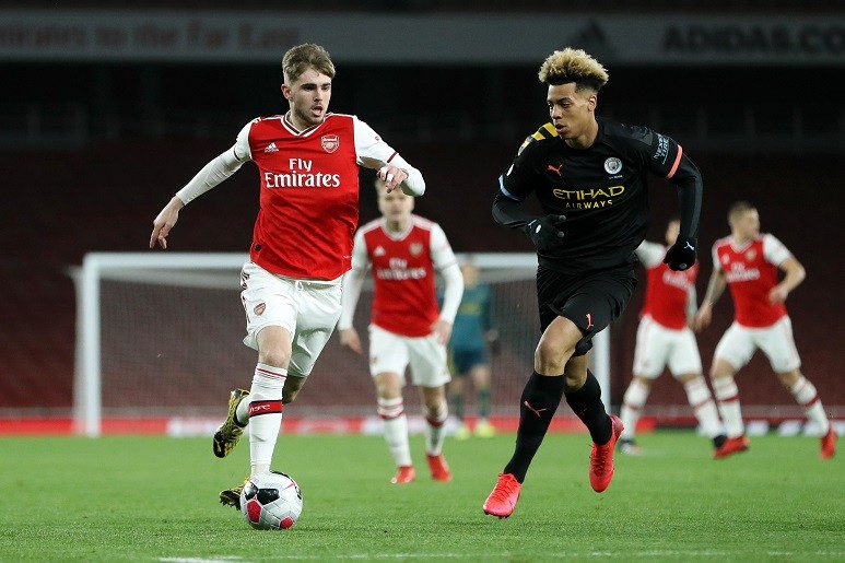 LONDON, ENGLAND - FEBRUARY 28: Zak Swanson of Arsenal is challenged by Felix Nmecha of Manchester City during the Premier League 2 match between Arsenal U23 and Manchester City U23 at Emirates Stadium on February 28, 2020 in London, England. (Photo by Linnea Rheborg/Getty Images)