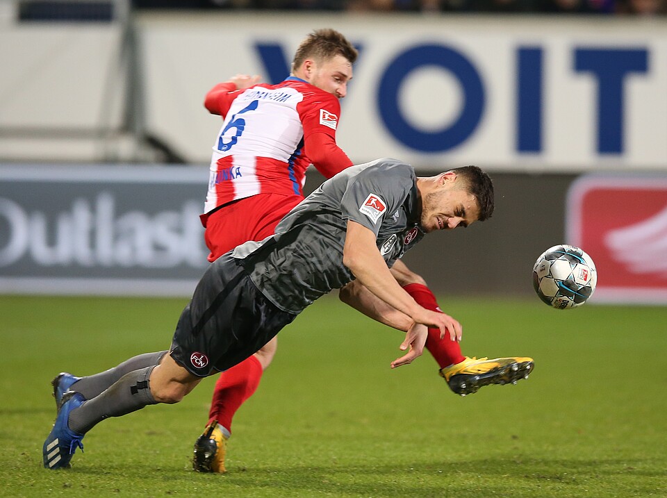 Konstantinos Mavropanos goes for the ball with FC Nürnberg (Photo via FCN.de)