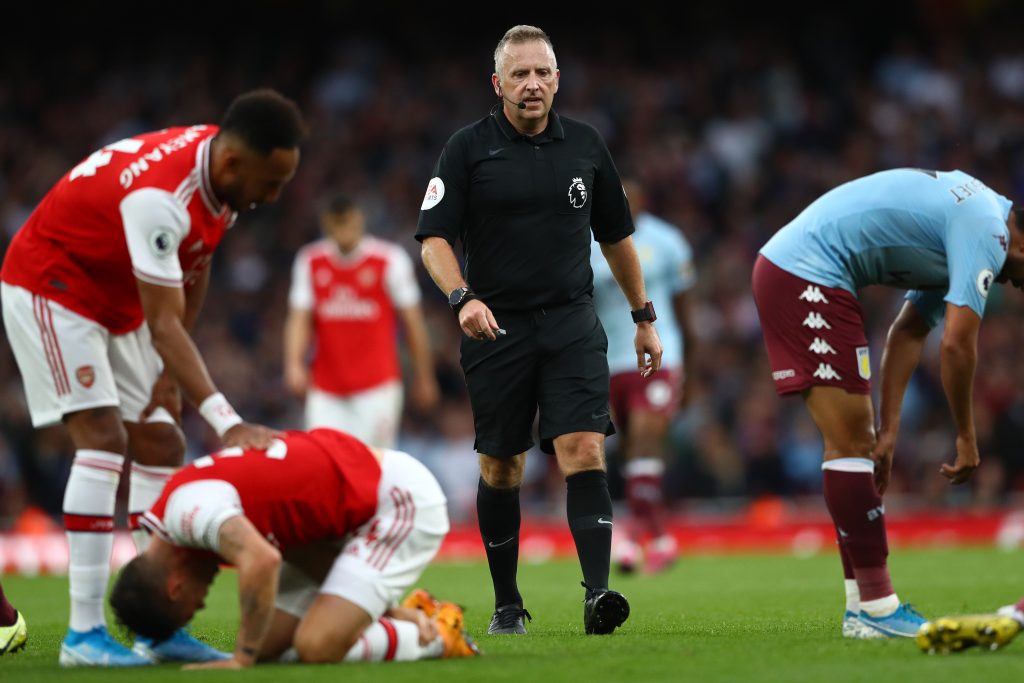 Referee Jon Moss looks on during the Premier League match between Arsenal FC and Aston Villa at Emirates Stadium on September 22, 2019 in London, United Kingdom.