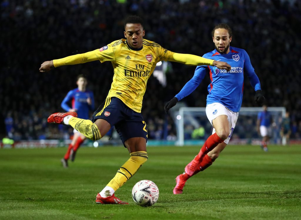 Joe Willock of Arsenal battles for possession with Marcus Harness of Portsmouth FC during the FA Cup Fifth Round match between Portsmouth FC and Arsenal FC at Fratton Park on March 02, 2020 in Portsmouth, England.