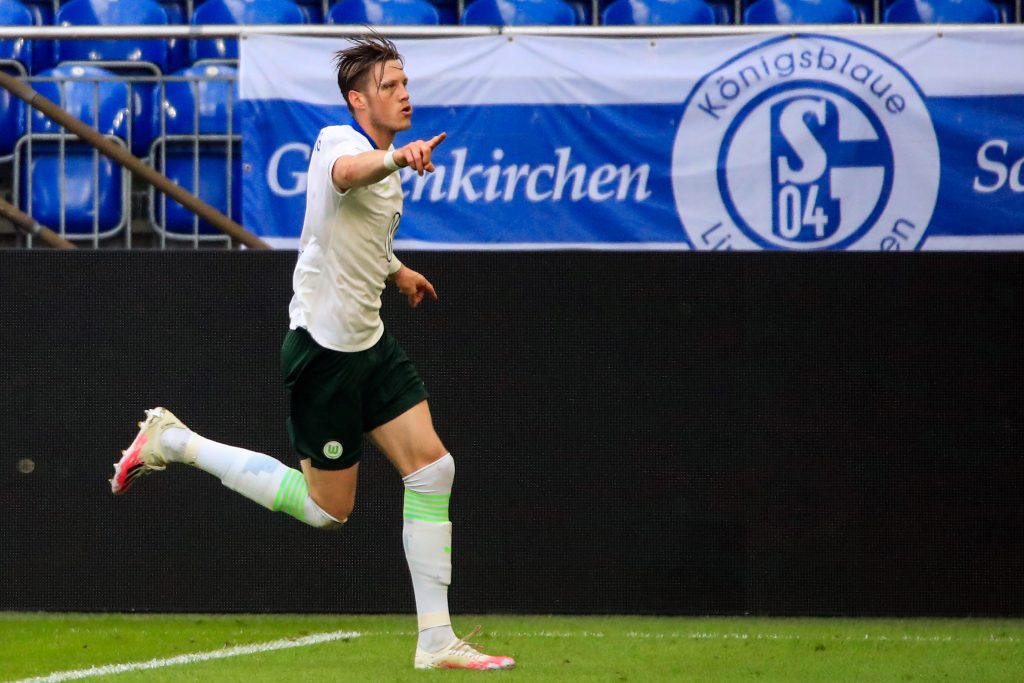 Wolfsburg's Dutch forward Wout Weghorst celebrates after scoring a goal during the German first division Bundesliga football match Schalke 04 v VfL Wolfsburg on June 20, 2020 in Gelsenkirchen, western Germany. (Photo by WOLFGANG RATTAY / POOL / AFP) / DFL REGULATIONS PROHIBIT ANY USE OF PHOTOGRAPHS AS IMAGE SEQUENCES AND/OR QUASI-VIDEO (Photo by WOLFGANG RATTAY/POOL/AFP via Getty Images)