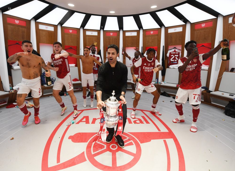 Mikel Arteta and Arsenal players celebrate in Wembley dressing room (via Arsenal.com)
