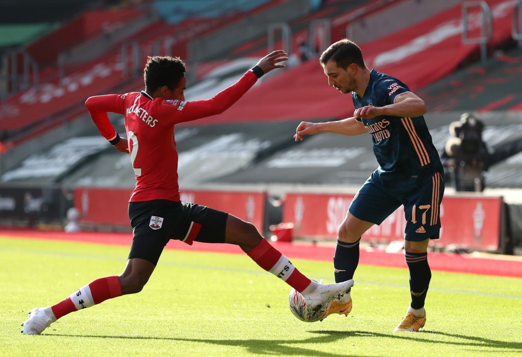 SOUTHAMPTON, ENGLAND: Cedric Soares of Arsenal is challenged by Kyle Walker-Peters of Southampton during The Emirates FA Cup Fourth Round match between Southampton FC and Arsenal FC on January 23, 2021. (Photo by Catherine Ivill/Getty Images)