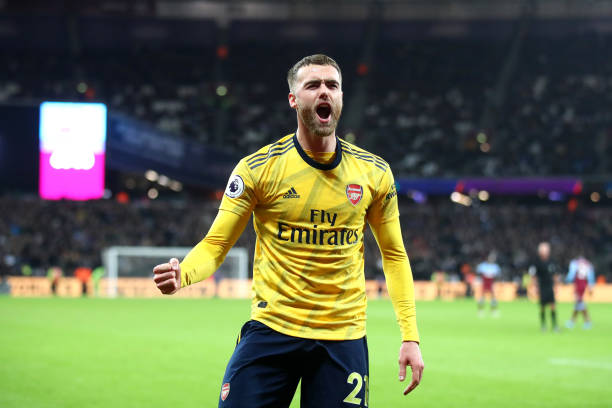 LONDON, ENGLAND - DECEMBER 09: Callum Chambers of Arsenal celebrates their second goal scored by Pierre-Emerick Aubameyang during the Premier League match between West Ham United and Arsenal FC at London Stadium on December 09, 2019 in London, United Kingdom. (Photo by Julian Finney/Getty Images)
