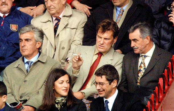 LONDON, UNITED KINGDOM:  Football manager Glenn Hoddle (C) and his long-time assistant John Gorman (R) and ex-Tottenham chairman, Irving Scholar (L), watch Arsenal play Tottenham at Highbury in London 31 March 2001. Hoddle is to take over the role of manager of Tottenham next week after leaving Southampton. Arsenal won the game 2-0 over their north London rivals. (Photo credit ADRIAN DENNIS/AFP via Getty Images)