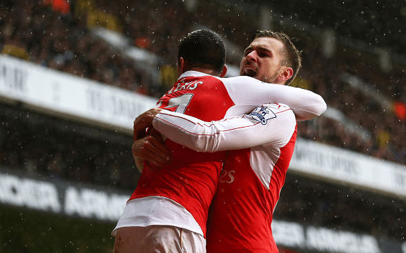 Alexis Sanchez (L) of Arsenal celebrates scoring his team's second goal with his team mate Aaron Ramsey (R) during the Barclays Premier League match between Tottenham Hotspur and Arsenal at White Hart Lane on March 5, 2016 in London, England.