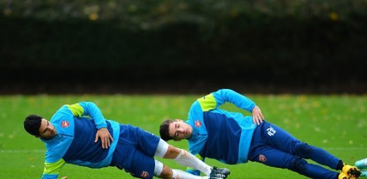 Arsenal's Spanish midfielder Mikel Arteta (L) and Spanish defender Hector Bellerin (R) attend a training session at the London Colney, North London, on November 3, 2014, on the eve of the UEFA Champions League Group D football match between Arsenal and Anderlecht. AFP PHOTO/GLYN KIRK (Photo credit should read GLYN KIRK/AFP/Getty Images)